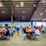 Guests enjoying the shaded seating the festival